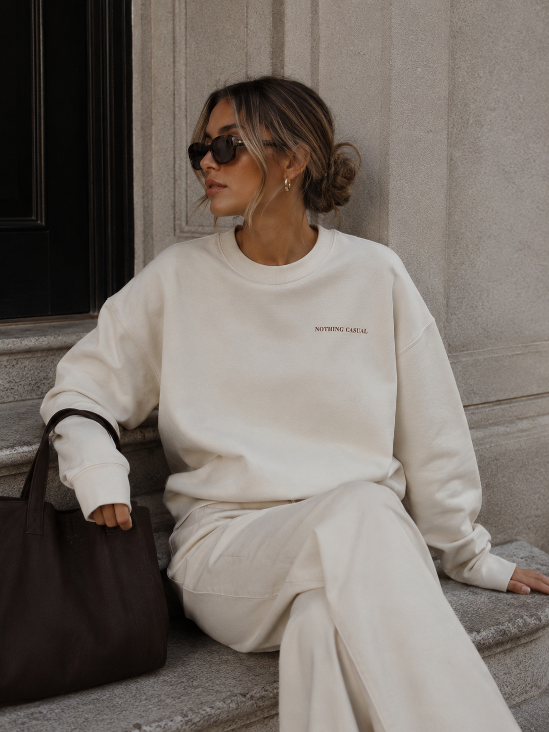 Women’s cream oversized crewneck sweatshirt with Nothing Casual embroidery